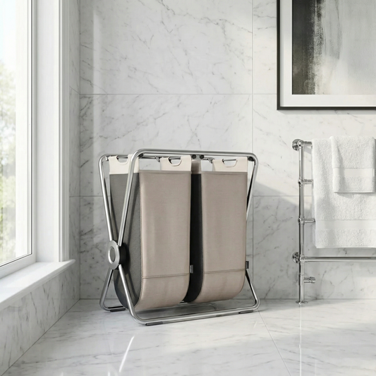 Simplehuman's Double X-Frame Hamper in a bathroom with marble tiles.