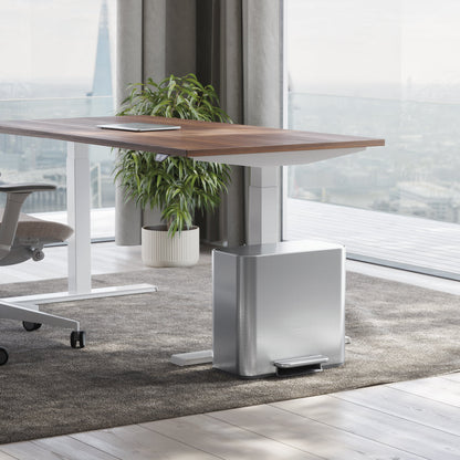 Simplehuman Brushed Stainless Steel 15L Mini Recycler Step Can under a desk, space-saving design with hands-free foot pedal.