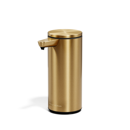 Angled view of Simplehuman 9 oz. Rechargeable Sensor Pump in Brass, hands-free operation.
