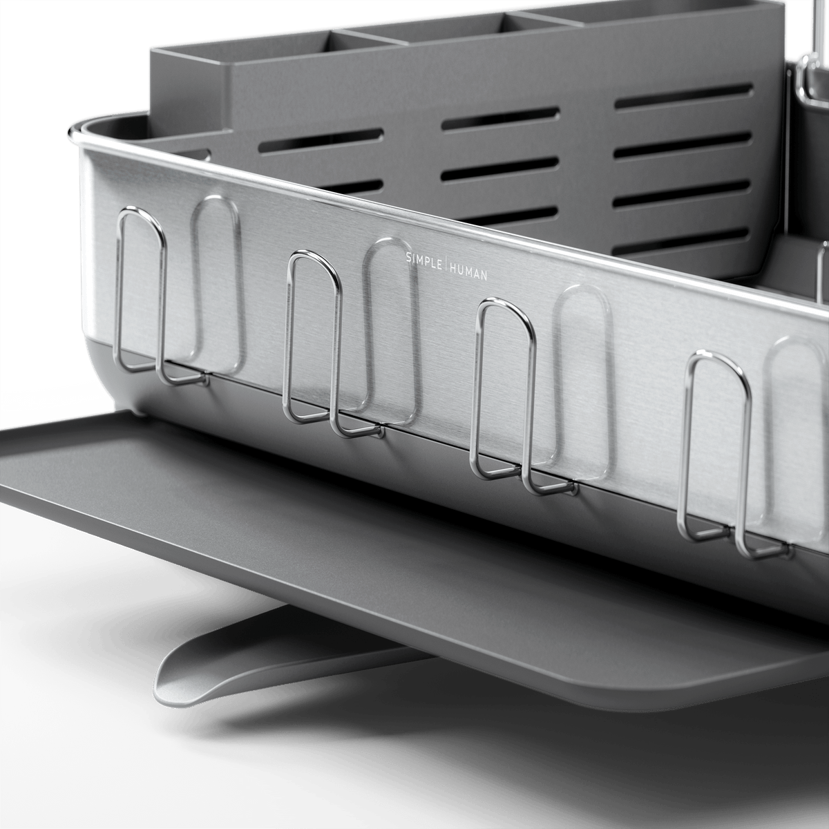 Close-up of Simplehuman Brushed Stainless Steel Steel Frame Dishrack showing integrated cup holders and slotted utensil caddy.
